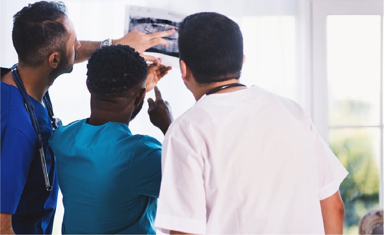 Doctors looking at a patient's information